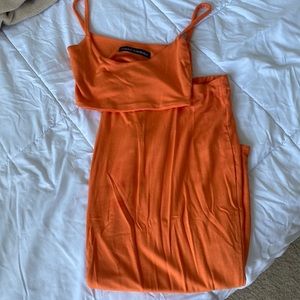 Naked wardrobe orange midi skirt set